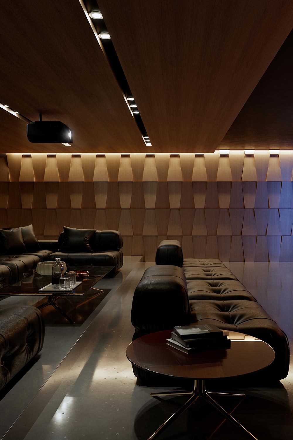 A modern home theater with black leather seating and geometric wooden wall panels for sound diffusion.