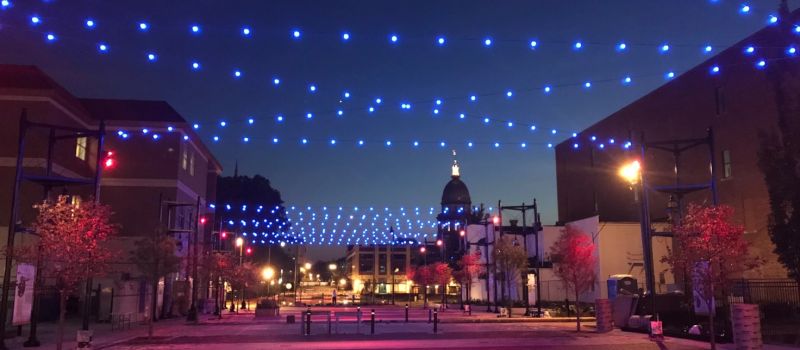 Street view at dusk with blue and yellow lighting