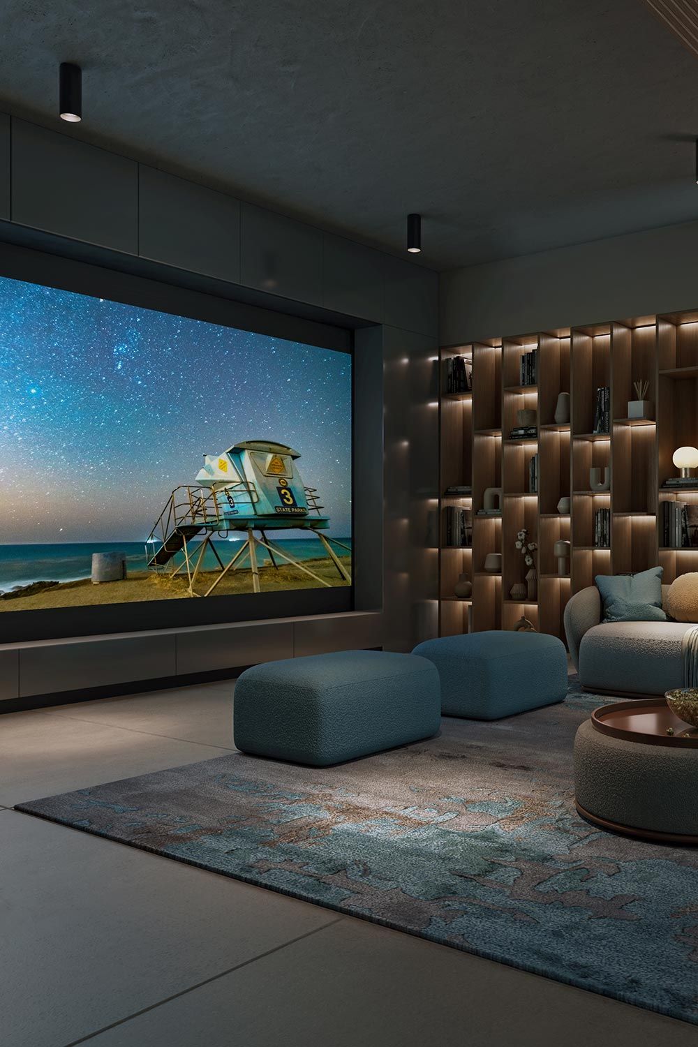 Cozy home theater with a large screen, modern furniture, and ambient lighting.